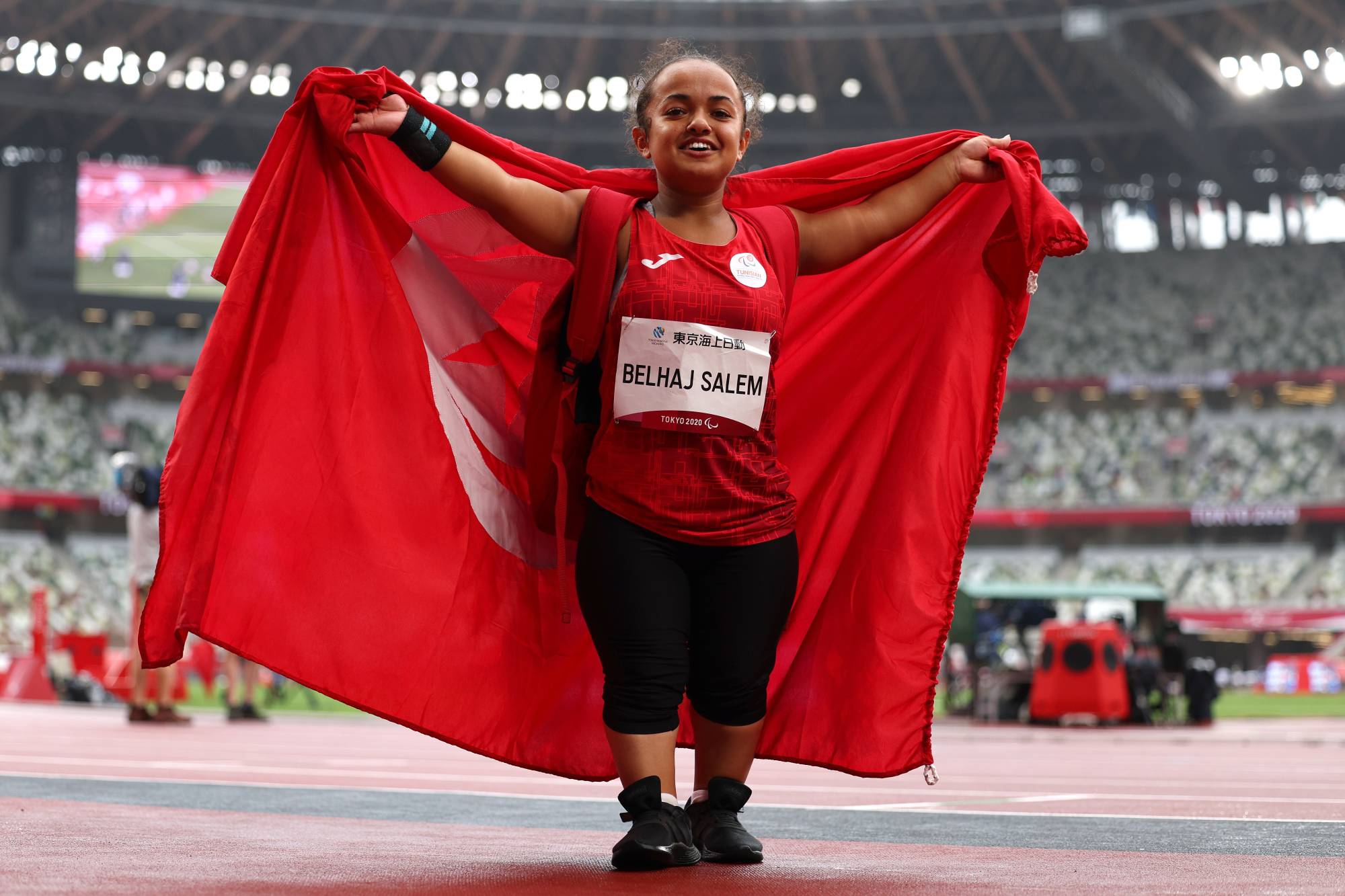 Tunisia's Nourhein Belhaj Salem celebrates after winning silver in the women's F40 shot put | REUTERS