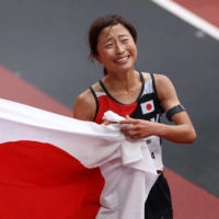 Misato Michishita of Japan celebrates winning gold and setting a new Paralympic record. | REUTERS