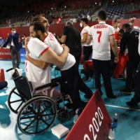Iran\'s Morteza Mehrzadselakjani and teammates celebrate winning the gold medal match in men\'s sitting volleyball against the Russian Paralympic Committee | REUTERS