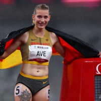 Germany\'s Lindy Ave celebrates after winning gold and setting a world record in the women\'s T38 400 meters | REUTERS