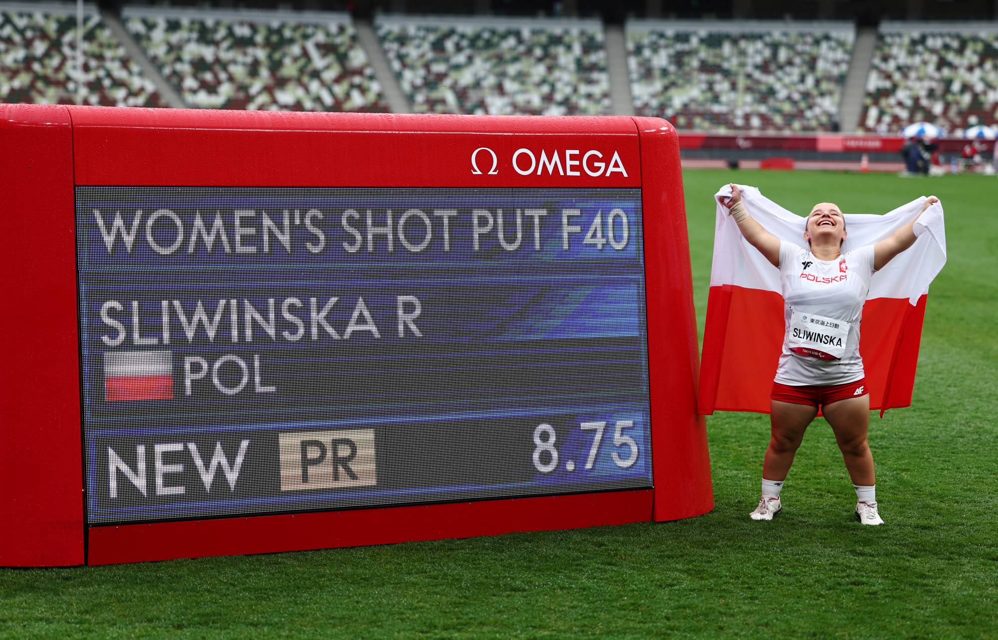 Poland's Renata Sliwinska celebrates her gold medal and setting a new Paralympic record in the F40 women's shot put. | REUTERS