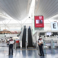 A nearly empty departures hall is seen at Tokyo\'s Haneda Airport on Aug. 9. | BLOOMBERG