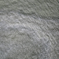 A sheen appears on the waters of the Gulf of Mexico near an oil industry platform. | NOAA / VIA REUTERS