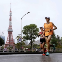 Misato Michishita and her guide run past Tokyo Tower during the women\'s T12 marathon on Sunday, the last day of the Tokyo Paralympics. | KYODO
