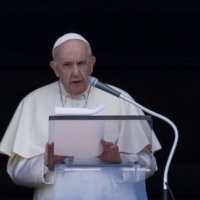 Pope Francis addresses the faithful during the Angelus prayer on Sunday at St Peter\'s square in the Vatican. | AFP-JIJI