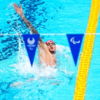 Maksym Krypak of Ukraine competes during a men\'s 200 meter individual medley SM10 heat at the Tokyo Paralympics on Friday. | CHANG W. LEE / THE NEW YORK TIMES
