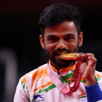 India\'s gold medalist Krishna Nagar in men\'s SH6 badminton singles on the podium in the medal ceremony | REUTERS