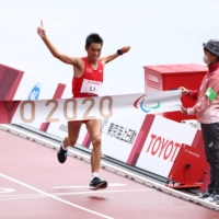 China\'s Chaoyan Li crosses the finish line to win gold and set a new Paralympic record in T46 men\'s marathon. | REUTERS
