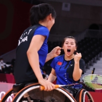China\'s Yutong Liu and Menglu Yin react during their women\'s double\'s badminton gold medal match against Japan\'s Sarina Satomi and Yuma Yamazaki. | REUTERS