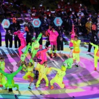 Colorfully dressed dancers and musicians perform during the closing ceremony. | REUTERS