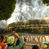 The view outside the National Stadium as firework go off. | KYODO
