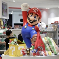 Nintendo Co. will be among the firms to join the 225-issue Nikkei average in a major change to the makeup of the blue-chip gauge. | BLOOMBERG