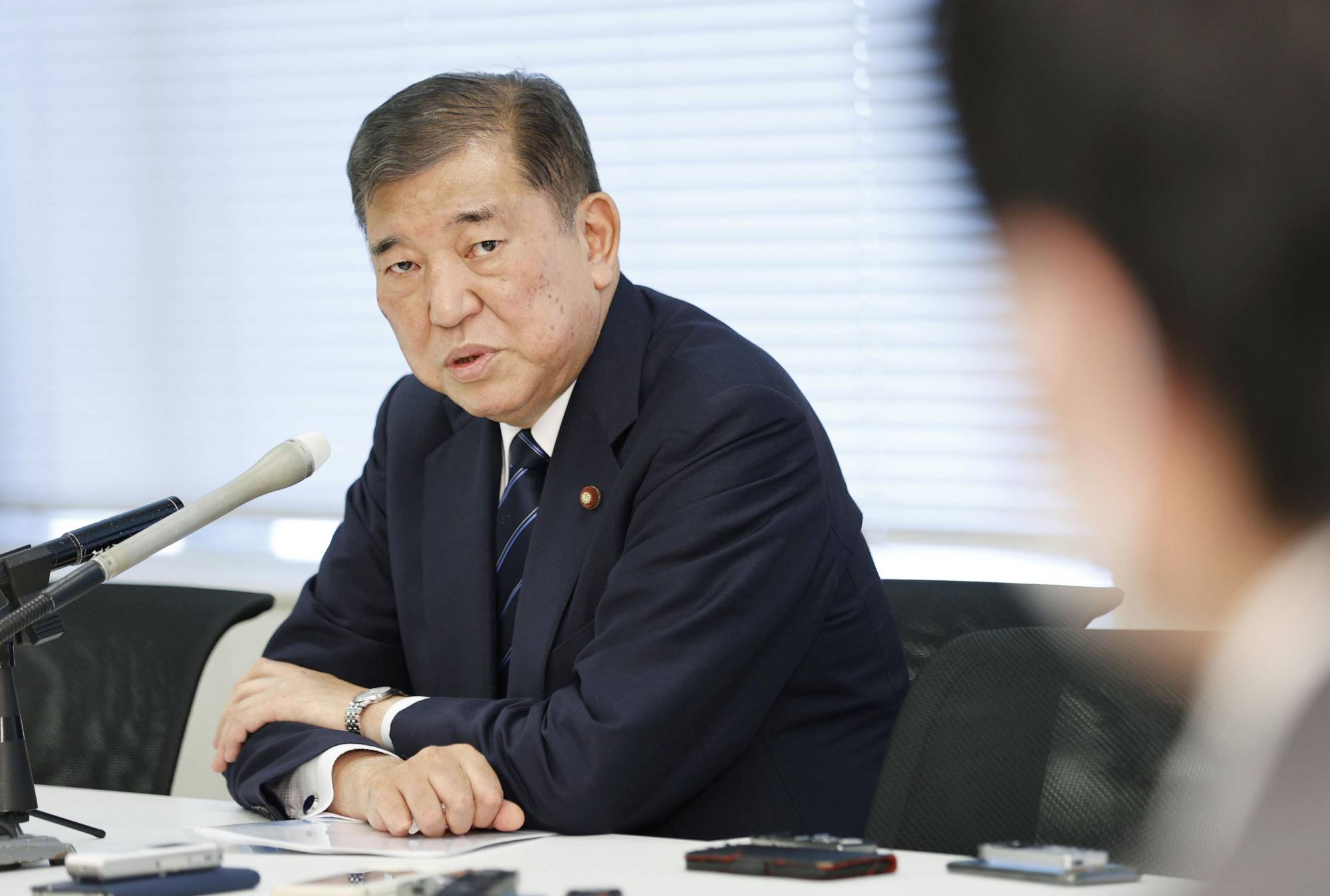 Former Defense Minister Shigeru Ishiba speaks to reporters at the Diet on Aug. 30. | KYODO