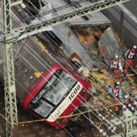 A Keikyu Line train collided with a truck and derailed in Yokohama in September 2019, leaving one dead and 30 injured. | KYODO