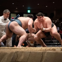Yersin Baltagulov (right) competes at the All Japan Championships on Dec. 6 at Ryogoku Kokugikan. | JOHN GUNNING