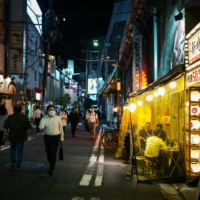 Although authorities request bars to refrain from selling alcohol and close by 8 p.m., many are choosing to keep their doors open. | RYUSEI TAKAHASHI
