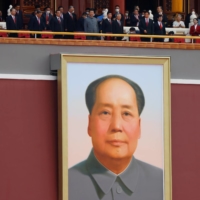 Chinese President Xi Jinping and other leaders stand above a giant portrait of late Chinese Chairman Mao Zedong on July 1. | REUTERS