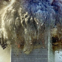The World Trade Center\'s north tower collapses on Sept. 11, 2001. | CHANG W. LEE / THE NEW YORK TIMES
