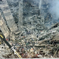 Emergency personnel comb through the wreckage of the World Trade Center in New York on Sept. 12, 2001. | RUTH FREMSON / THE NEW YORK TIMES
