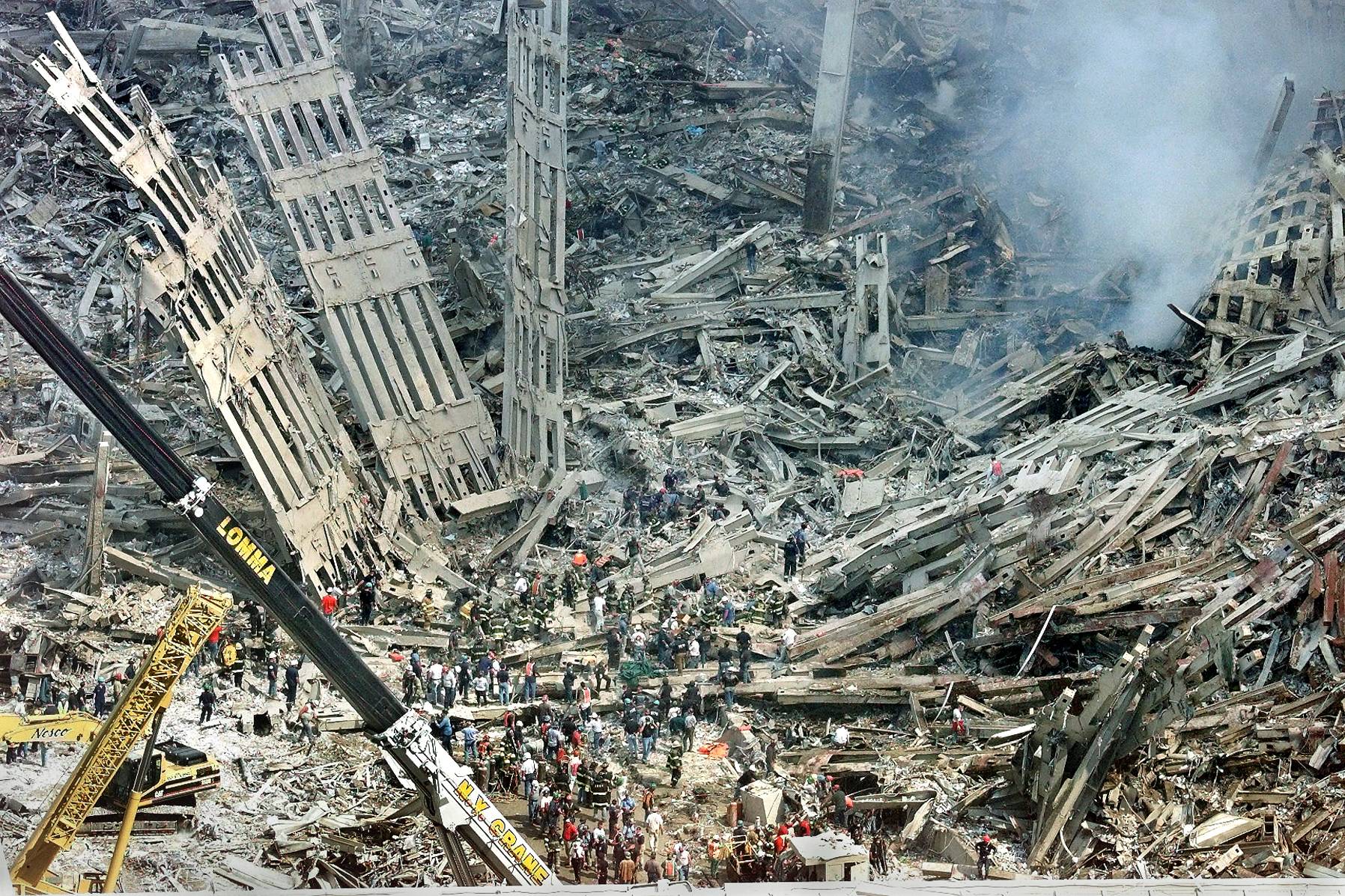 Emergency personnel comb through the wreckage of the World Trade Center in New York on Sept. 12, 2001. | Ruth Fremson / The New York Times