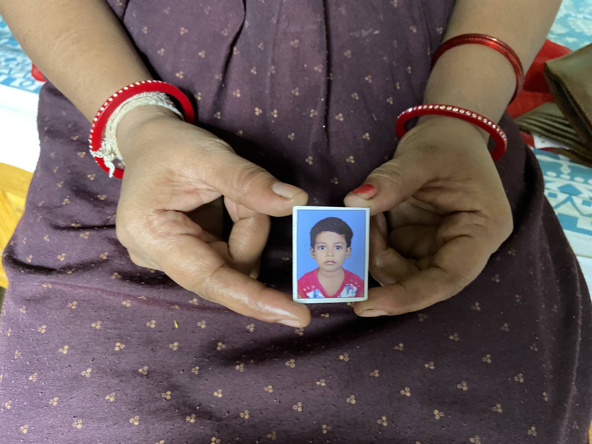 Nisha Umashankar Dandekar shows a picture of her 5-year-old daughter, who died in a leopard attack last year in Chandrapur. | THOMSON REUTERS FOUNDATION