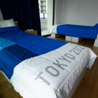 The recyclable beds from the athletes\' village in Tokyo are likely to be used at a temporary medical facility in Osaka by the end of this month. | POOL / VIA REUTERS