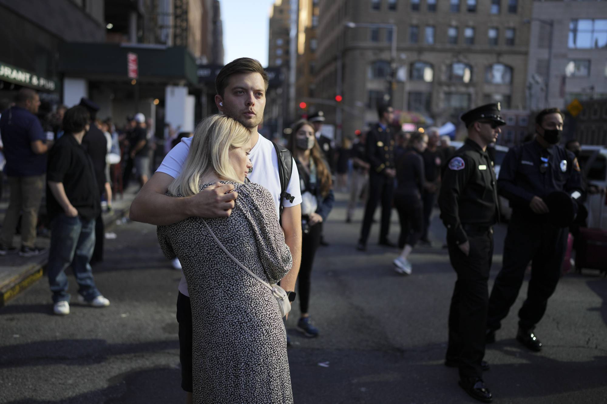 Raphael Christiani, and his wife Nadia, from Germany, embrace near One World Trade Center in New York on the morning of the 20th anniversary of 9/11. | CHANG W. LEE/THE NEW YORK TIMES
