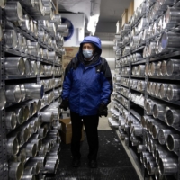 Lonnie Thompson, professor and research scientist at the Ohio State University, stands in a minus 30-degree freezer where ice core samples from glaciers are kept in the Byrd Polar and Climate Research Center in Columbus, Ohio, on Jan. 15. | REUTERS