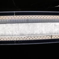 An ice core sample from a glacier lays on a light table in the Byrd Polar and Climate Research Center in Columbus, Ohio, on Jan. 15. | REUTERS