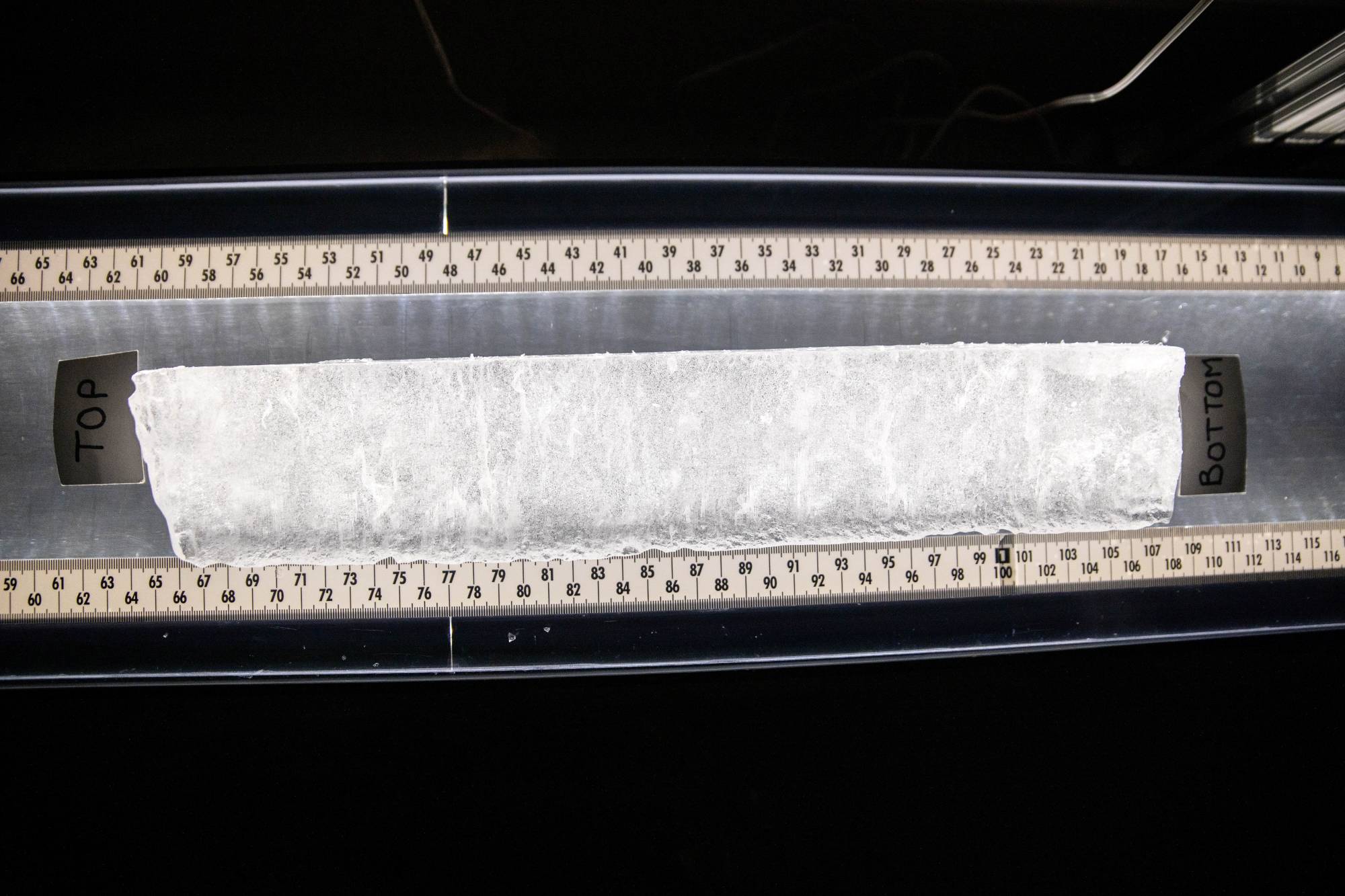 An ice core sample from a glacier lays on a light table in the Byrd Polar and Climate Research Center in Columbus, Ohio, on Jan. 15. | REUTERS