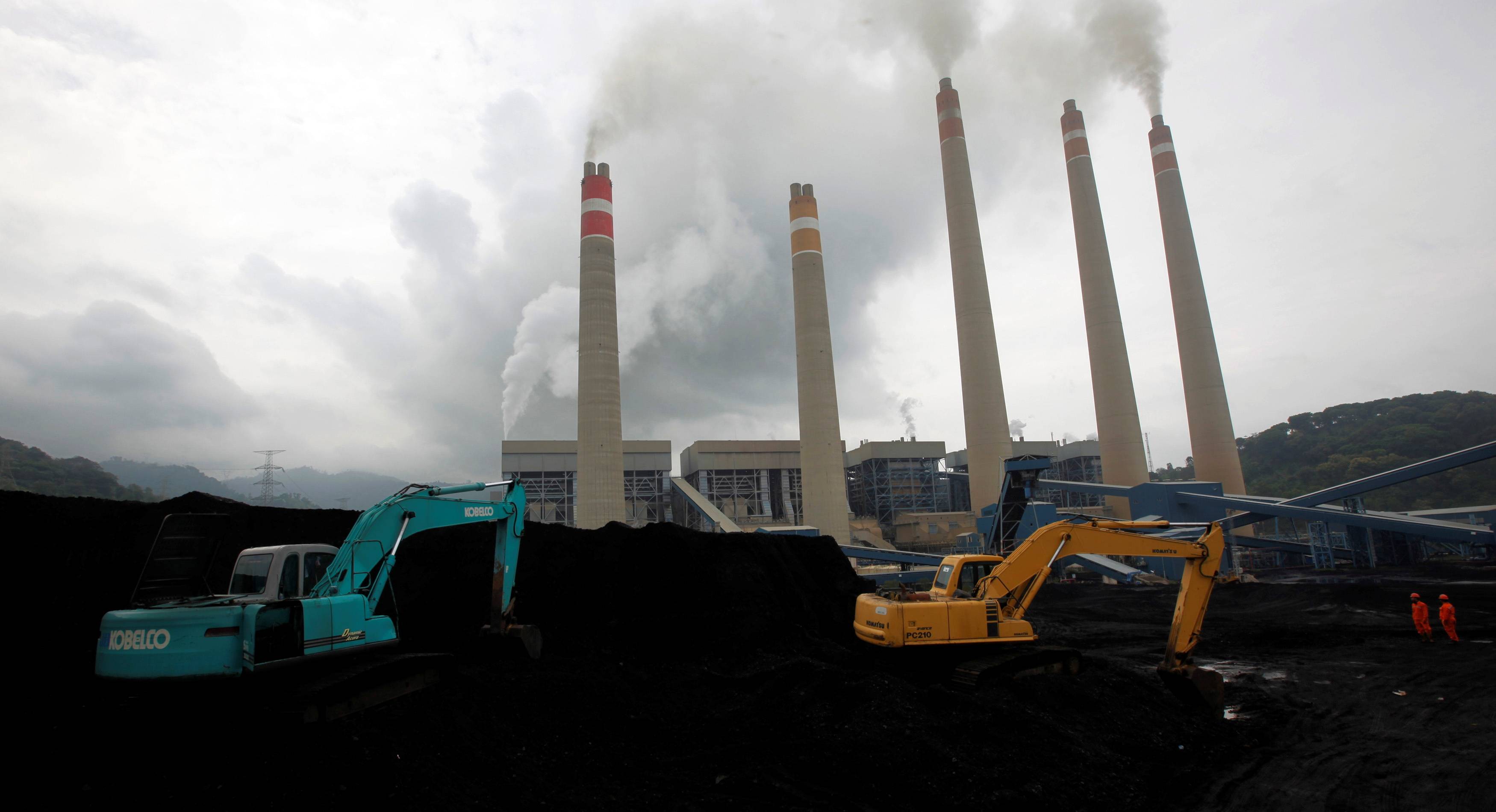 Excavators pile coal in a storage area in an Indonesian Power Plant in Suralaya, Banten province. | Reuters 
