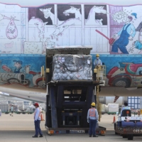 Workers unloaded a shipment of the Pfizer COVID-19 vaccine from a plane at Taoyuan International Airport near Taipei on Sept. 2. | TAIWAN CDC / VIA AFP-JIJI