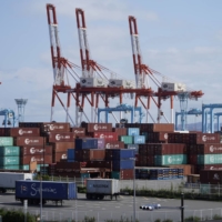 Japan\'s exports extended double-digit gains in August but the pace of growth weakened as the pandemic hit Asia\'s supply chains. | BLOOMBERG