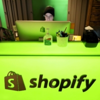 An employee works at Shopify\'s headquarters in Ottawa in October 2018. | REUTERS
