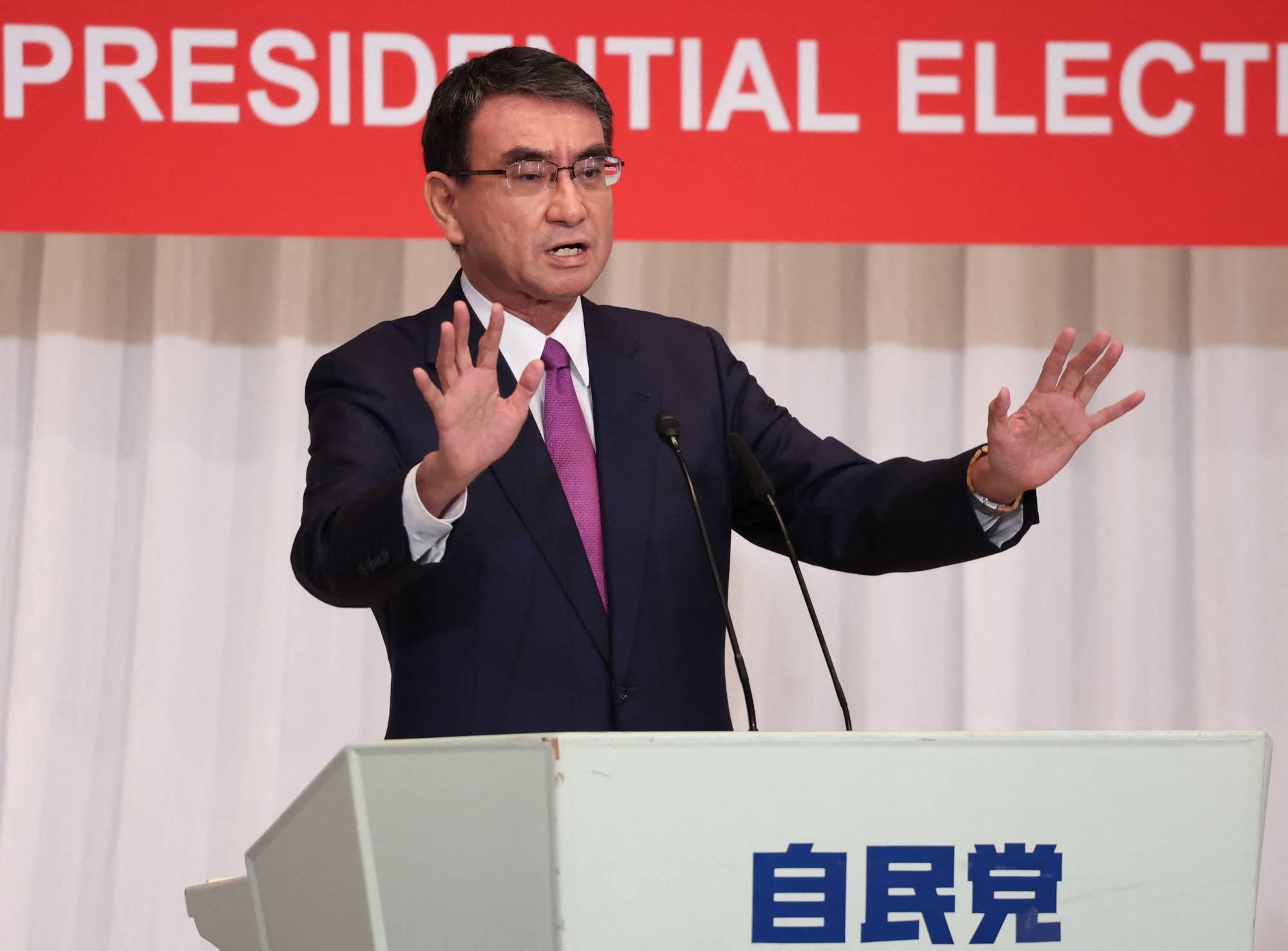 Vaccine chief Taro Kono delivers a campaign speech in Tokyo on Friday. | POOL / AFP-JIJI