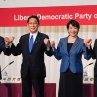 From left: Vaccine chief Taro Kono, former Foreign Minister Fumio Kishida, former internal affairs minister Sanae Takaichi, and the LDP\'s deputy secretary-general Seiko Noda pose before a news conference in Tokyo on Friday, ahead of the ruling party\'s September 29 election. | POOL / VIA AFP-JIJI