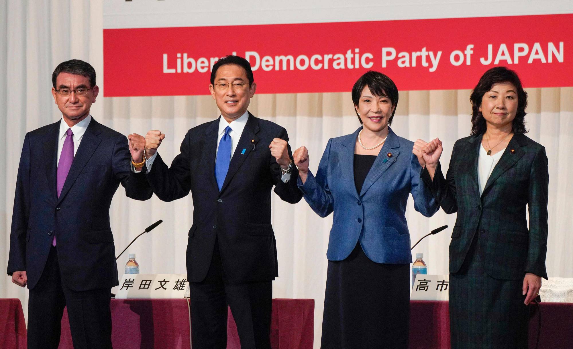 From left: Vaccine chief Taro Kono, former Foreign Minister Fumio Kishida, former internal affairs minister Sanae Takaichi, and the LDP's deputy secretary-general Seiko Noda pose before a news conference in Tokyo on Friday, ahead of the ruling party's September 29 election. | POOL / VIA AFP-JIJI