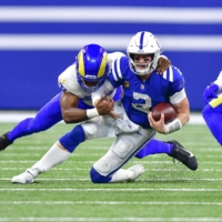 Colts quarterback Carson Wentz is sacked by Rams linebacker Justin Hollins during the second half of their game in Indianapolis on Sunday. | USA TODAY / VIA REUTERS