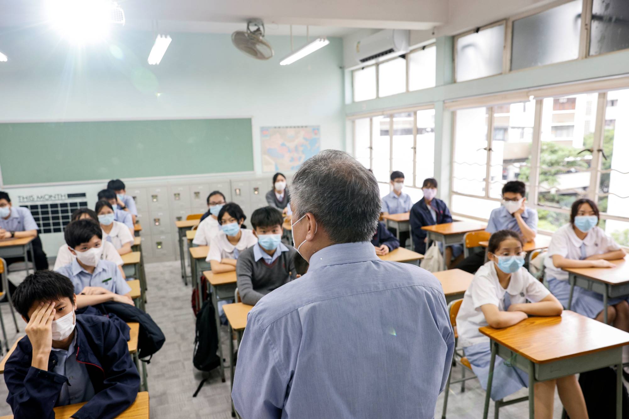 A teacher introduces himself during the first day of the new term in Hong Kong on Sept. 1. | Reuters 