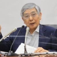 Haruhiko Kuroda, governor of the Bank of Japan, speaks during a news conference in Tokyo in July. | BLOOMBERG