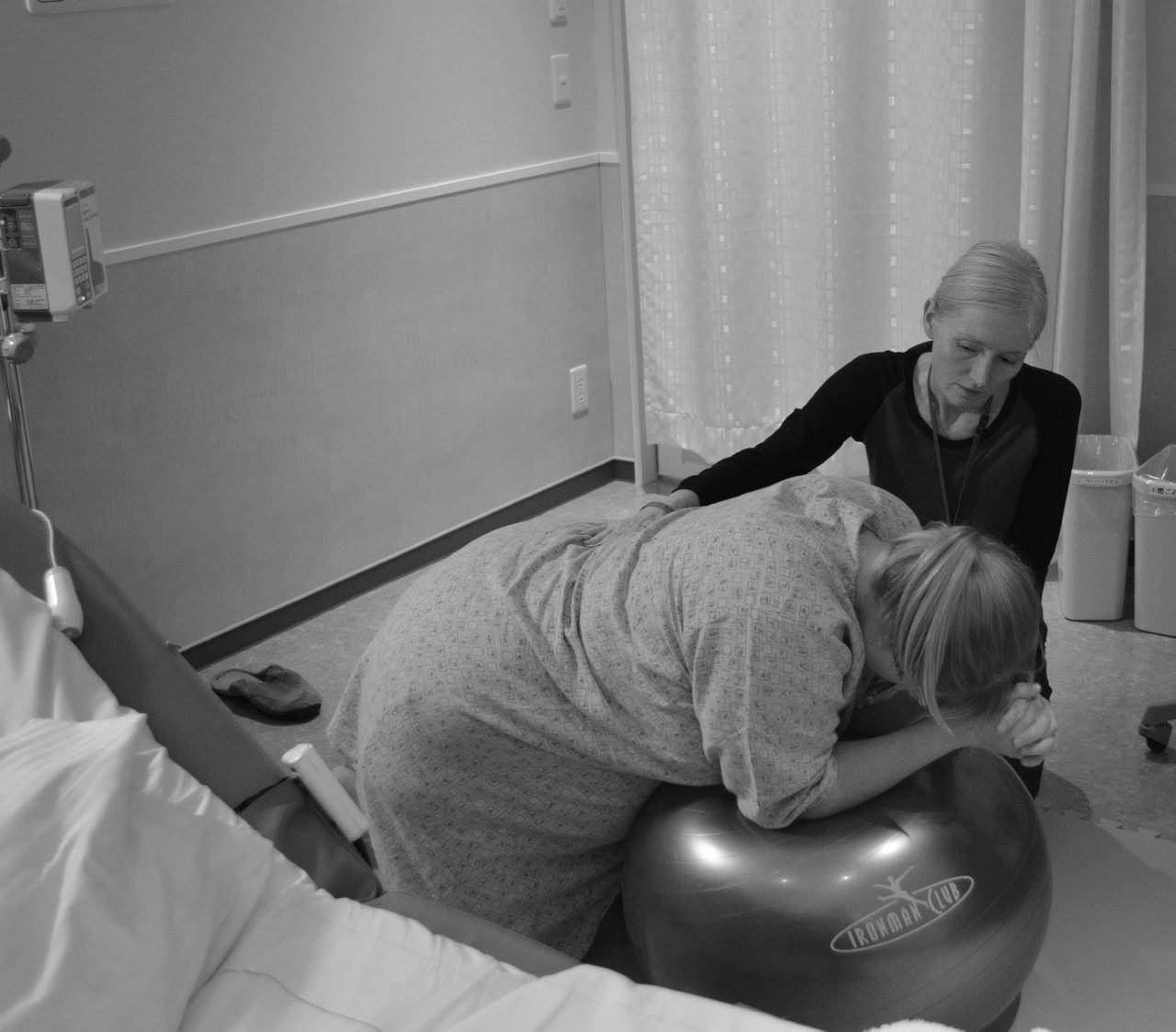 Stephanie Kawai helps a client during a labor. As a doula, she stays with the woman while the doctor will often step out.  | COURTESY OF STEPHANIE KAWAI