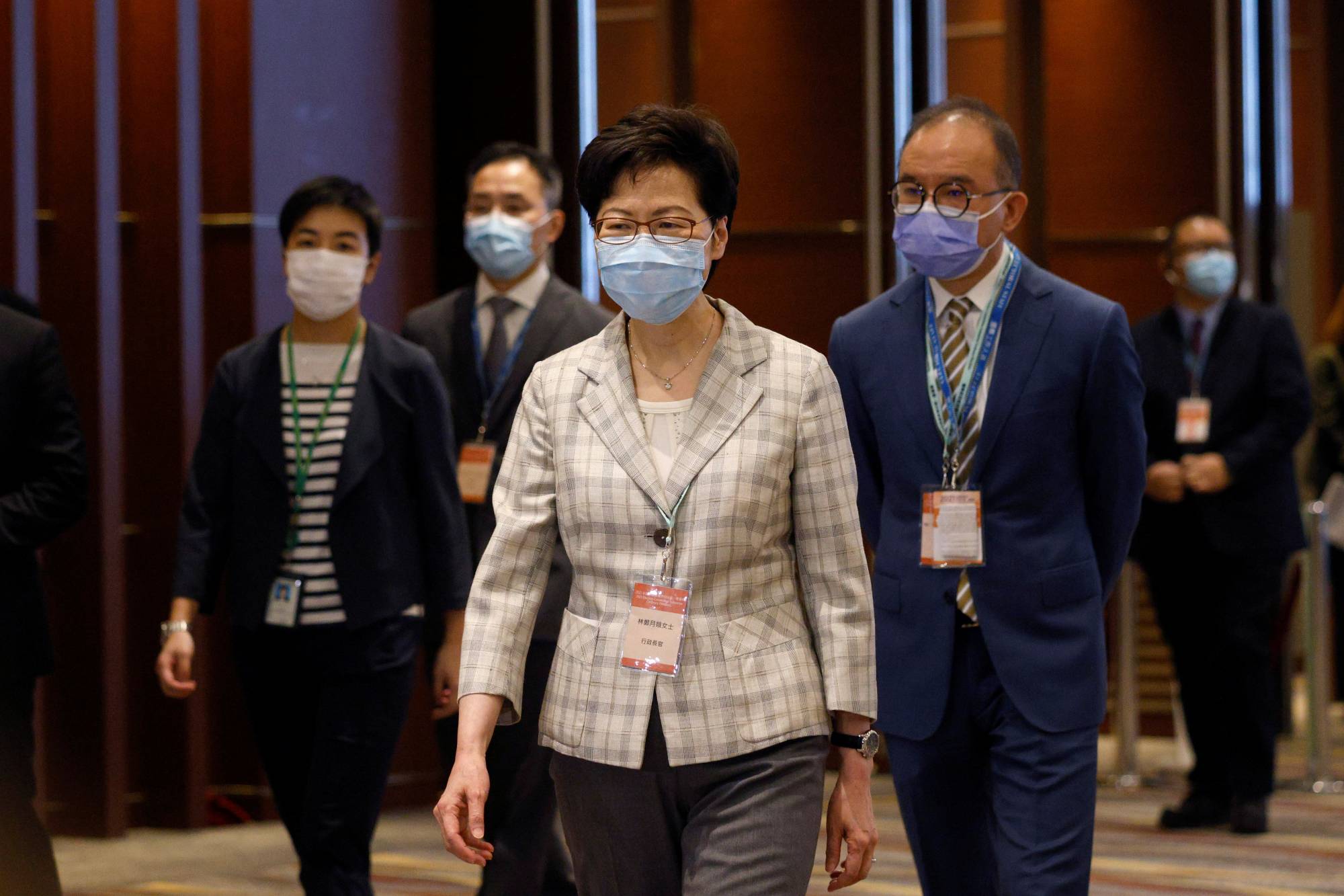 Hong Kong Chief Executive Carrie Lam visits a polling station during voting for the election committee on Sunday. | REUTERS