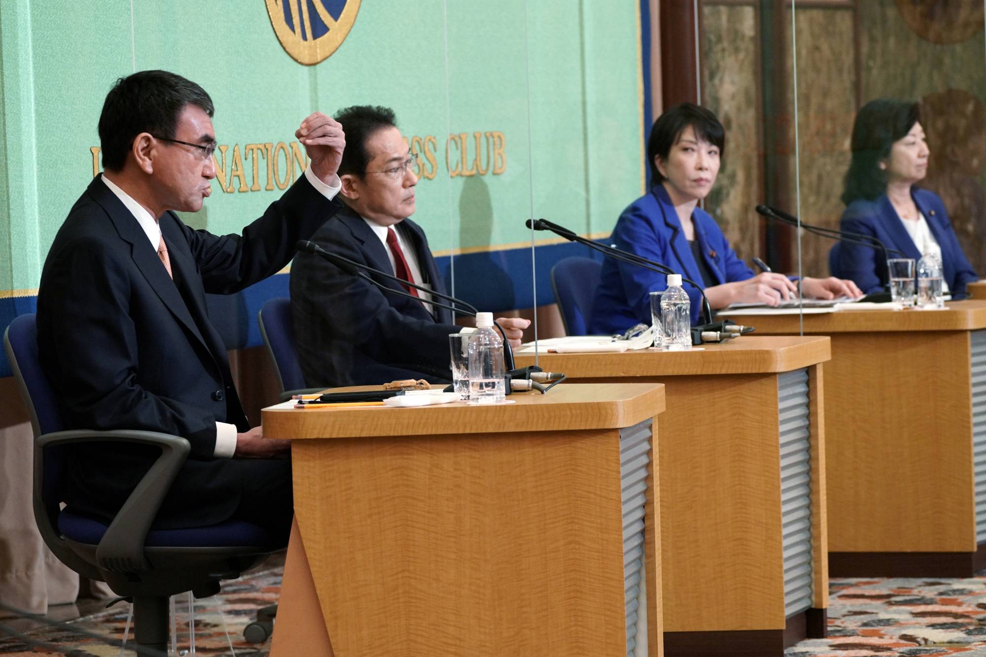 LDP presidential candidates (from left) Taro Kono, Fumio Kishida, Sanae Takaichi and Seiko Noda take part in a debate held at the Japan National Press club in Tokyo on Saturday.  | POOL / VIA REUTERS