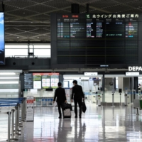 Narita Airport in February. Relaxed quarantine rules will only apply to people who have received one of the three COVID-19 shots that are authorized by the Japanese government: Pfizer-BioNTech, Moderna and AstraZeneca | BLOOMBERG
