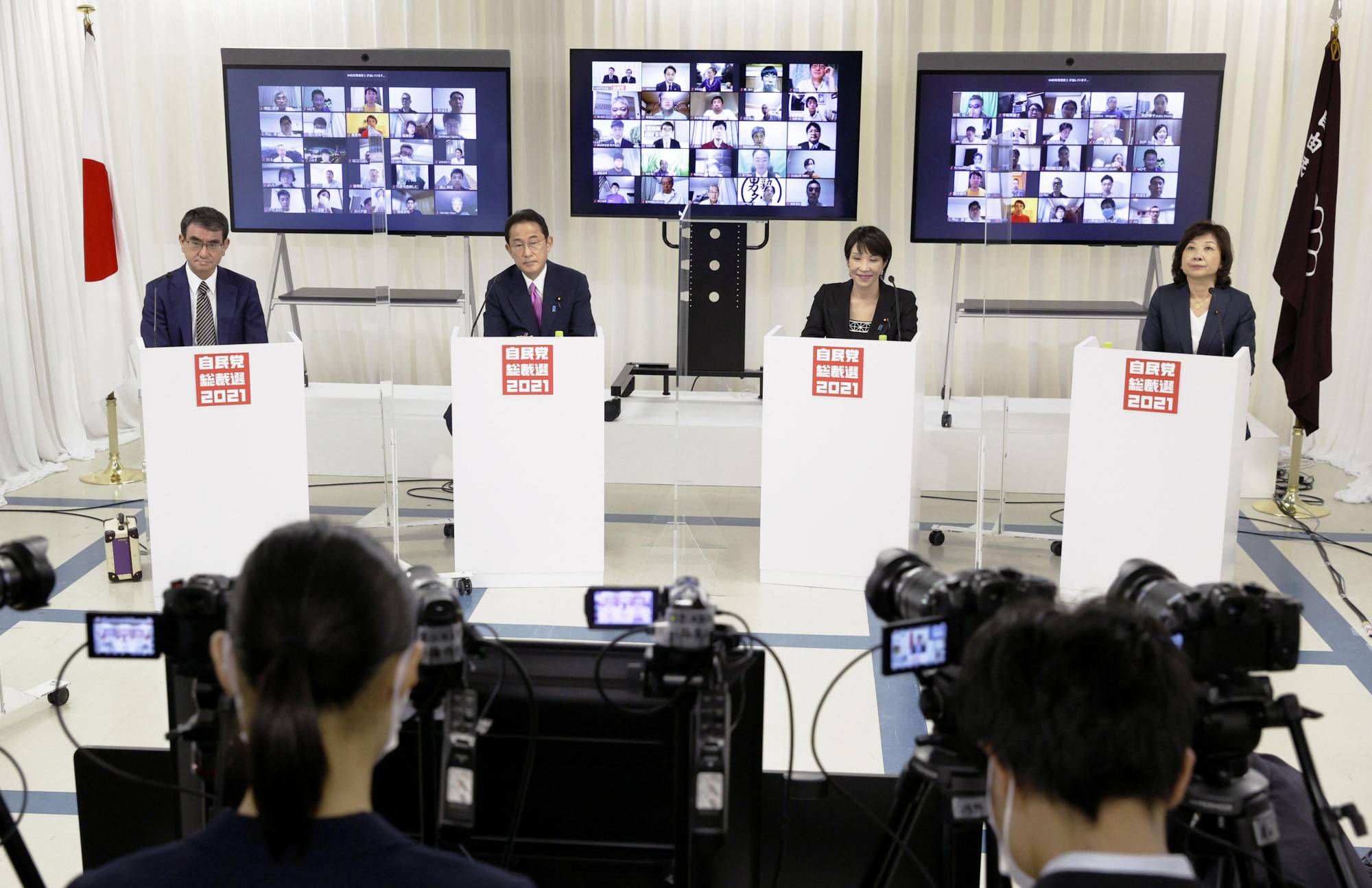 LDP leadership hopefuls Taro Kono (left to right), Fumio Kishida, Sanae Takaichi and Seiko Noda hold a debate at the party's headquarters in Tokyo on Friday.  | KYODO