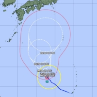 The Meteorological Agency\'s forecast for Typhoon Mindulle. The wider area further north indicates the storm\'s uncertain path. | METEOROLOGICAL AGENCY 
