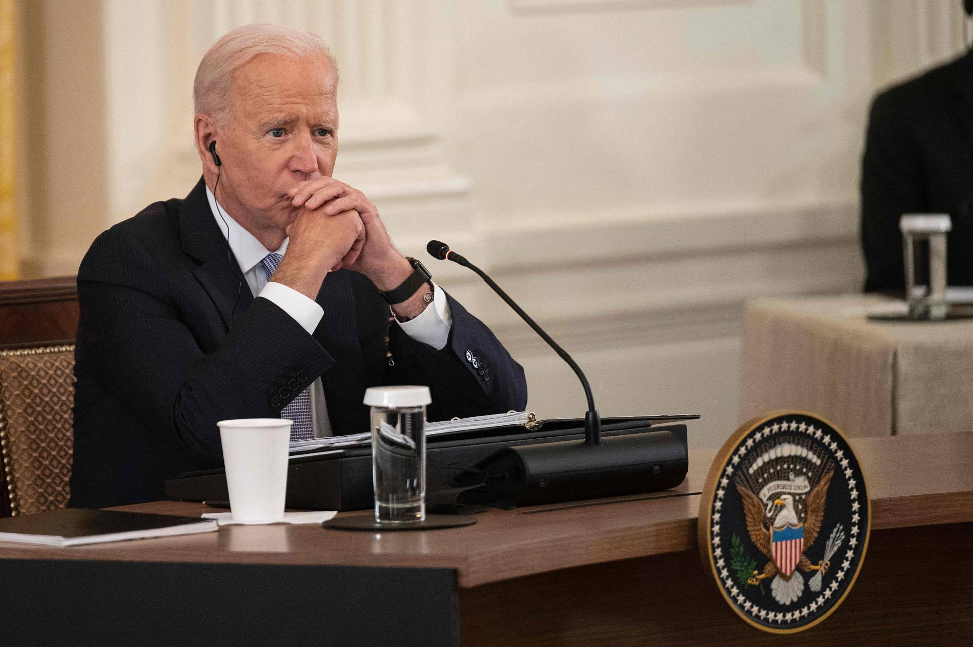 U.S. President Joe Biden listens as Indian leader Narendra Modi speaks with Prime Minister Suga Yoshihide and Australian leader Scott Morrison during the first-ever in-person 'Quad' leaders summit at the White House in Washington on Friday. | AFP-JIJI