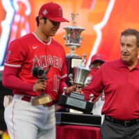 Angels two-way player Shohei Ohtani receives the team\'s MVP and best pitcher awards from owner Artie Morena on Saturday in Anaheim, California. | USA TODAY / VIA REUTERS