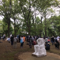 People gather at an open-air soup kitchen in Tokyo\'s Ueno Park. | ALEX K.T. MARTIN
