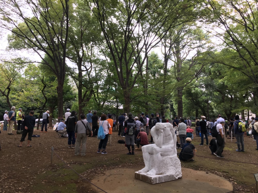 People gather at an open-air soup kitchen in Tokyo's Ueno Park. | ALEX K.T. MARTIN